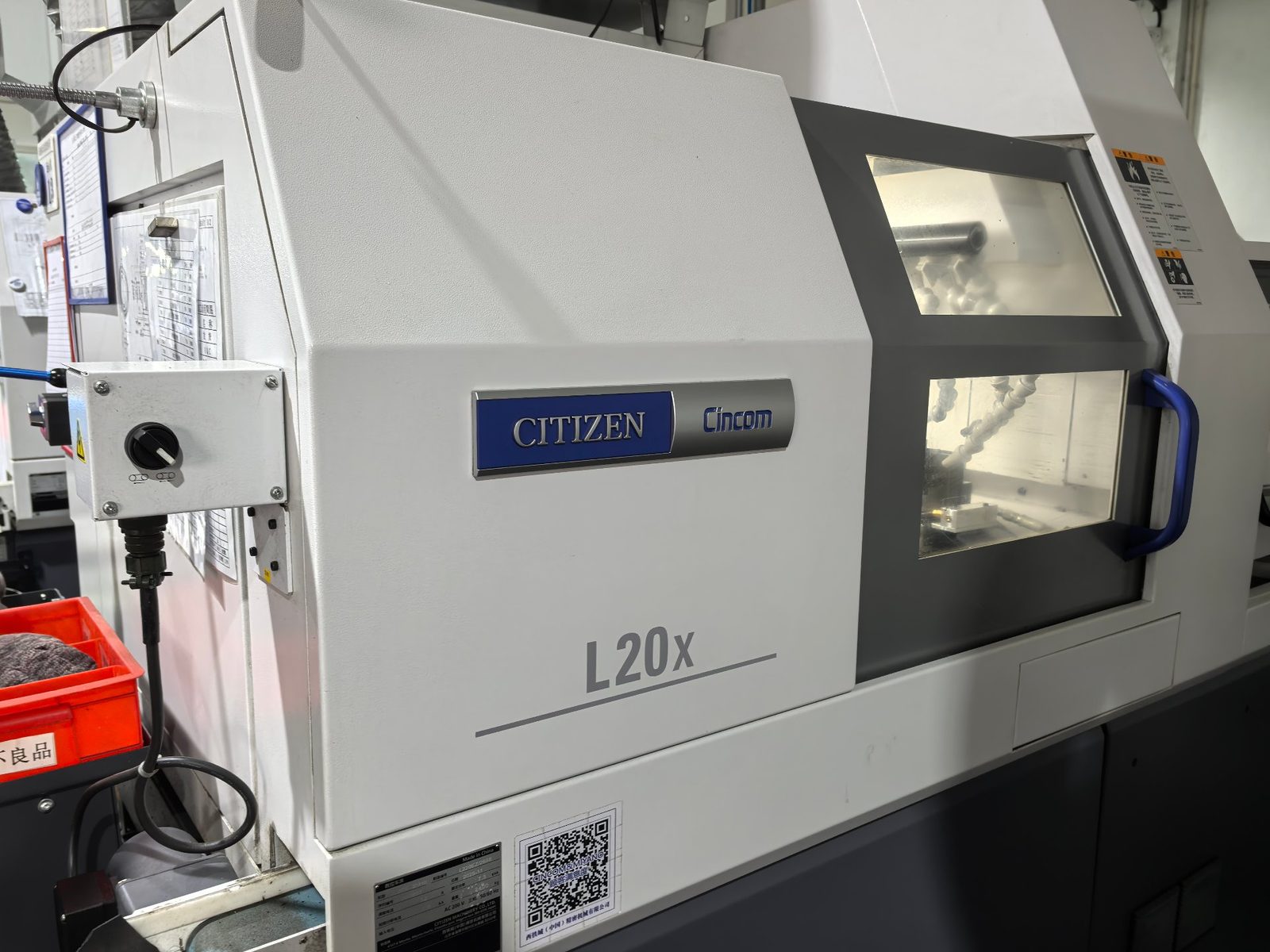 Citizen Cincom L20 Swiss-type CNC lathe with its cutting window open